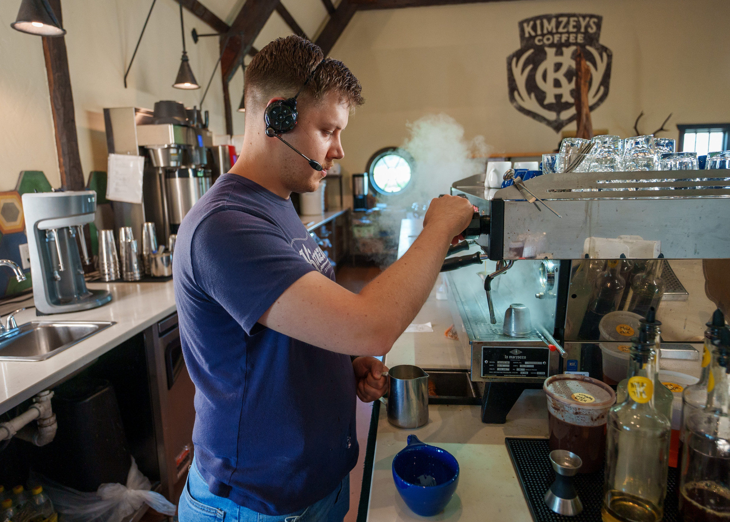 Coffee barista making steam