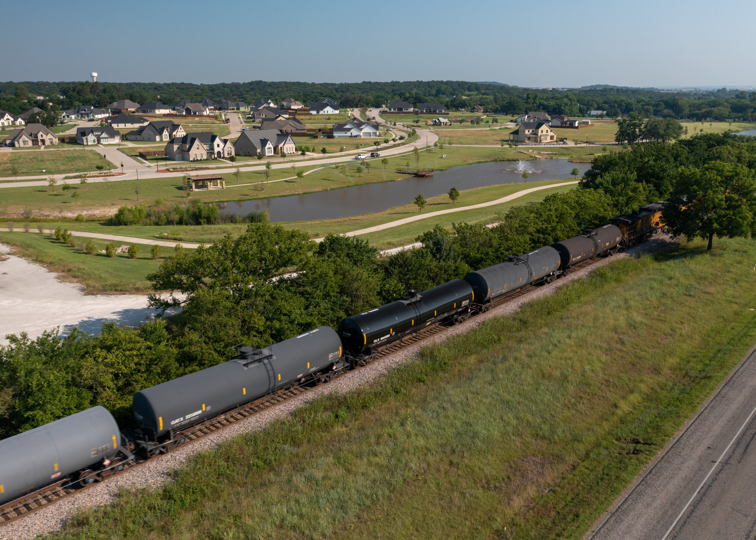 aerial view of train with argyle neighborhood in the background